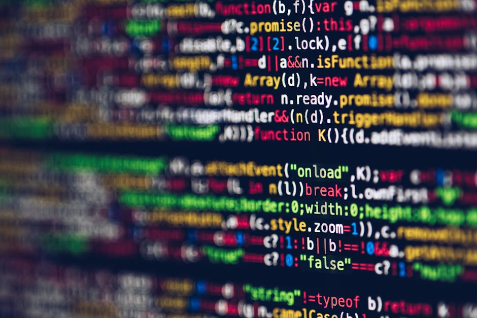 A close-up view of a computer screen displaying colorful lines of programming code, including text such as 'function', 'var', 'return', 'true', and 'false', with syntax highlighting in shades of yello